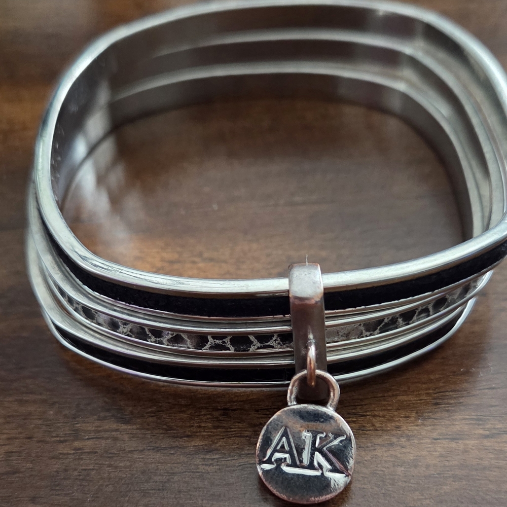 Silver and Black Bangle Bracelet with Charm